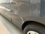 a close up of a car that has been painted gray