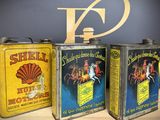 three tins that are sitting next to each other