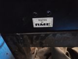 a close up of a metal object with a sticker on it