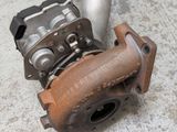 a picture of a turbocharger that is on the ground