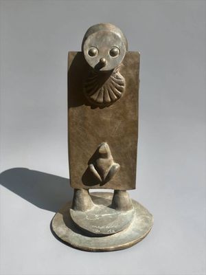 sculpture of a bird on a pedestal with a bird on it ' s back