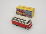 a red and white toy bus with a box on the side