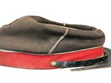 a brown hat with a red band on top of it