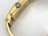 an image of a close up of a watch on a white surface