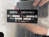 a person taking a picture of a sign on the side of a vehicle