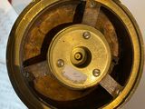 a close up of a clock on a table