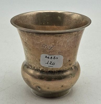 a silver vase that has a price tag on it