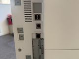 a white computer on the wall in the room