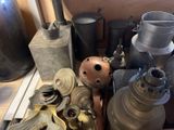 many different types of old metal items on the shelf