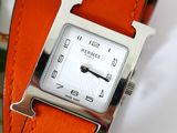 an image of a close up of a wrist watch with a leather band