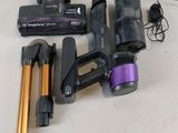 several different types of vacuum cleaners and accessories on a table