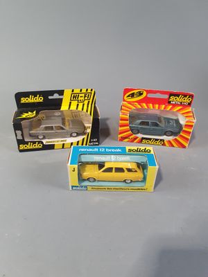 three small toy cars are sitting on a table next to each other