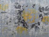 a picture of a rug with yellow and gray designs on it