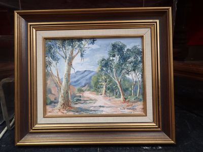 un tableau représentant un paysage avec des arbres et une montagne en arrière-plan