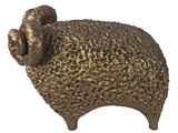 a statue of a sheep that is sitting on a table