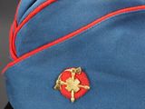 a blue hat with a red ribbon on it