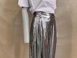 silver metallic plea pants with white t - shirt on mannequin base
