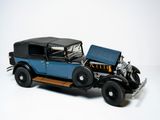 a model of a blue car with a black top