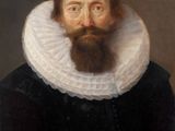 portrait of a bearded man with a white collar and a black dress