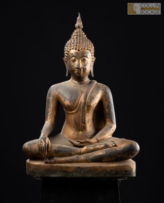 an image of a statue of a person sitting in a lotus position