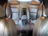a picture of a car seat with a cup holder in it