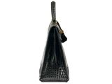 the small black bag has a gold handle and a long strap