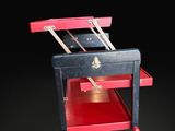 a red and black cart with a red top