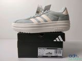 a pair of shoes that are on top of a box