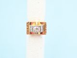 a close up of a ring on a napkin on a blue background