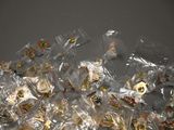 a pile of food wrapped in plastic bags on a table