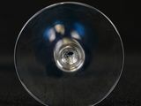 a close up of a wine glass on a table