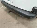 an image of a white van parked in a parking lot