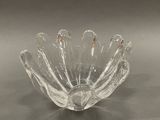 a glass bowl that is sitting on a table