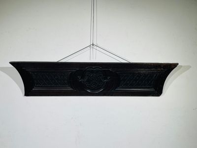 a black plaque hanging on the wall of a room