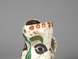 une image représentant un vase sur lequel est peint un visage