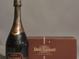 a bottle of champagne sitting next to a box