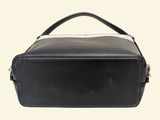 a black and white bag with a handle on a white background