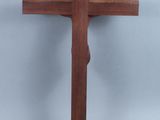 a wooden cross on a gray background