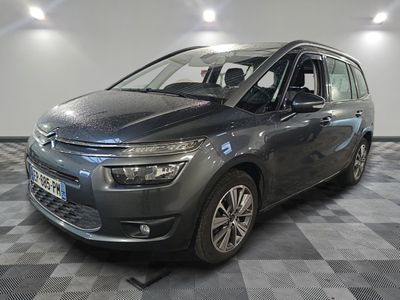 the grey citrole is parked on a checkered tile floor