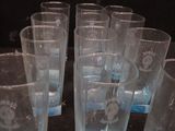 a lot of glasses that are sitting on a table