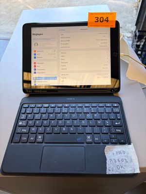 a laptop computer sitting on top of a table with a price tag on it