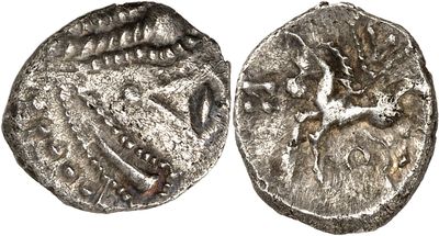 a silver coin with an image of a bird on it