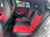 a red and black seat in the back of a car
