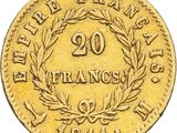 a close up of a gold coin with a wreath on it