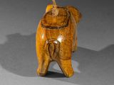 wooden figurine of a dog with a hat on it ' s head