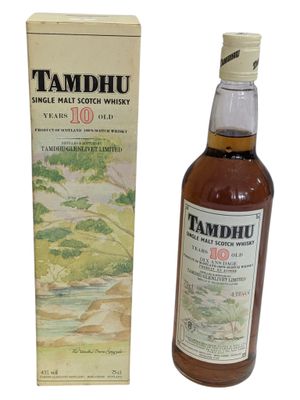 the bottle of tamdhu is next to the box