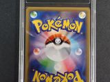 a close up of a pokemon card in a plastic case