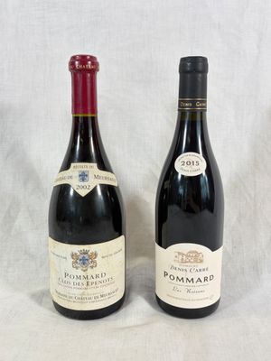 deux bouteilles de vin posées l'une à côté de l'autre sur une table