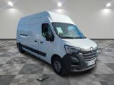 the white van is parked in a large room with checkered floor