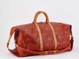an image of a red duffel bag sitting on top of a white surface